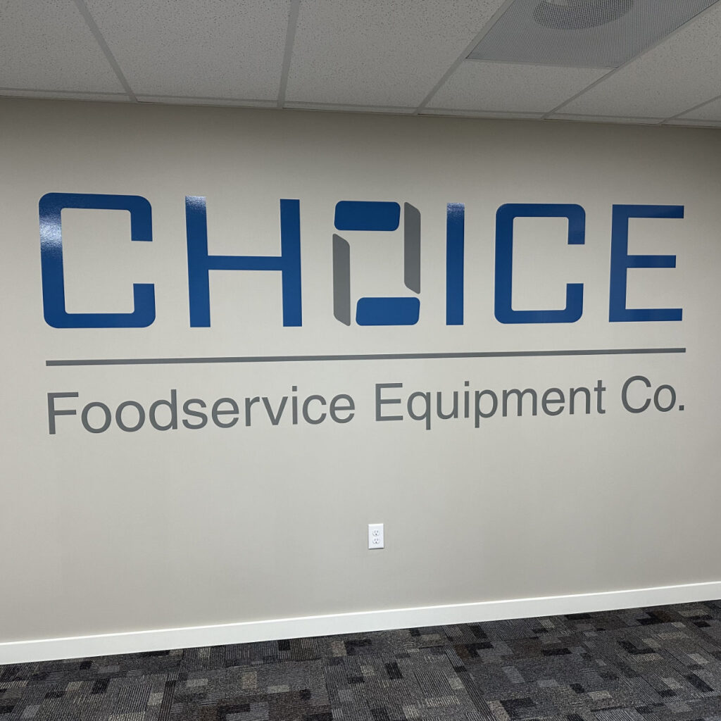 A photo of vinyl letters, printed gray and blue, for Choice Foodservice Equipment Co.