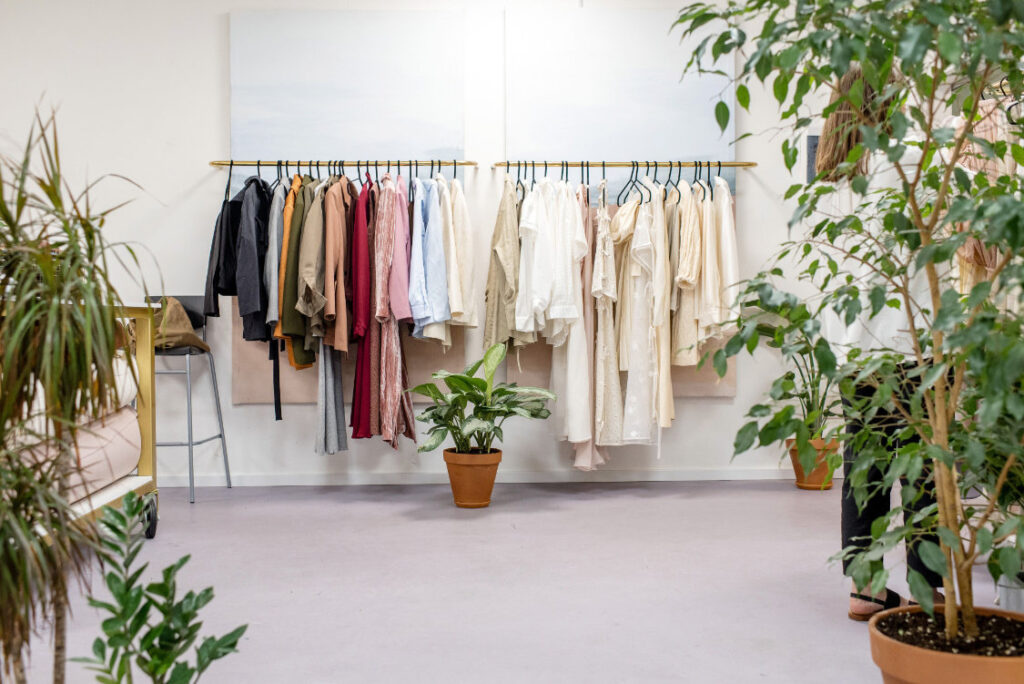 Apparel items are hung on a railing.